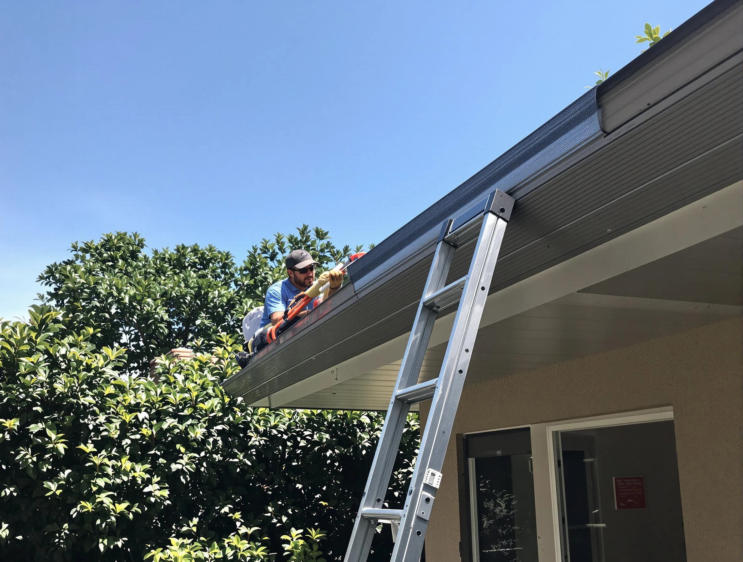 Brecksville Roofing Company installing gutter guards for a homeowner in Brecksville, OH